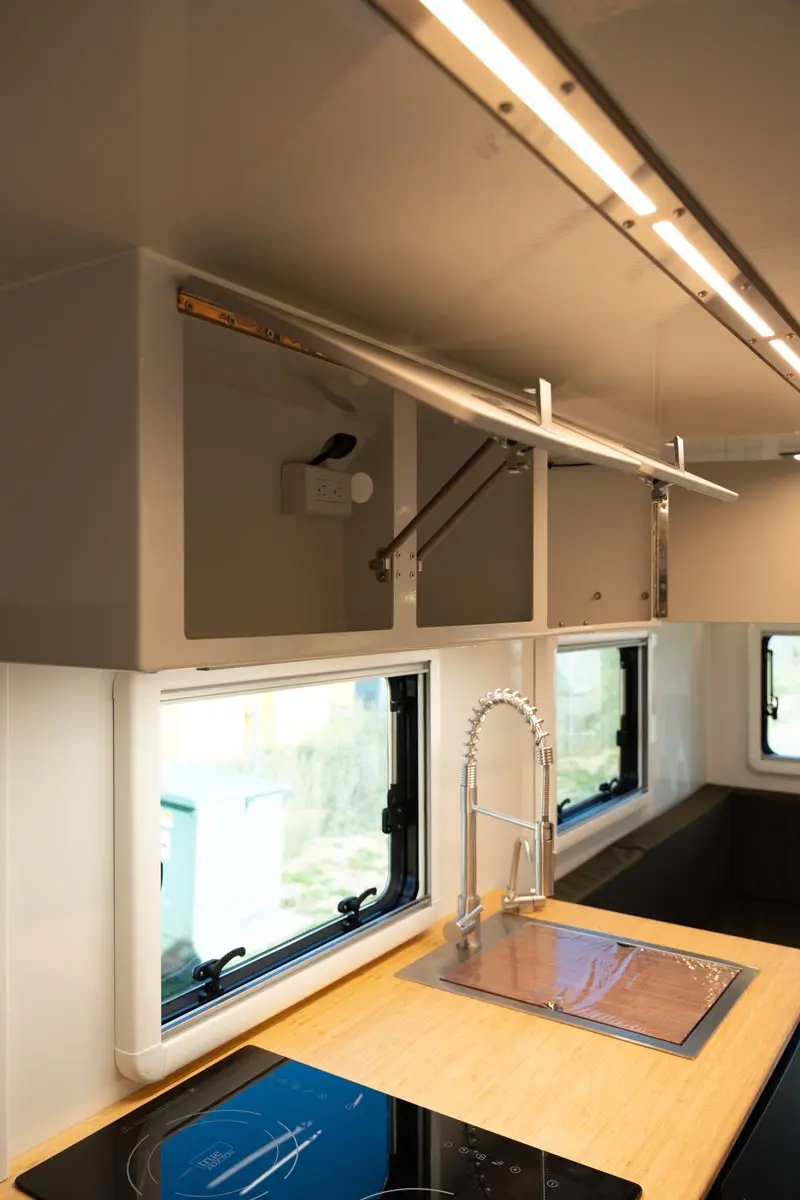 OEV Summit expedition camper galley kitchen with induction cooktop