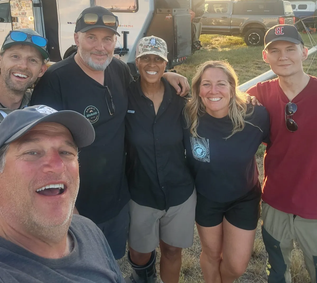 OEV owners and friends gathered for a group photo at sunset during The Big Thing 2026
